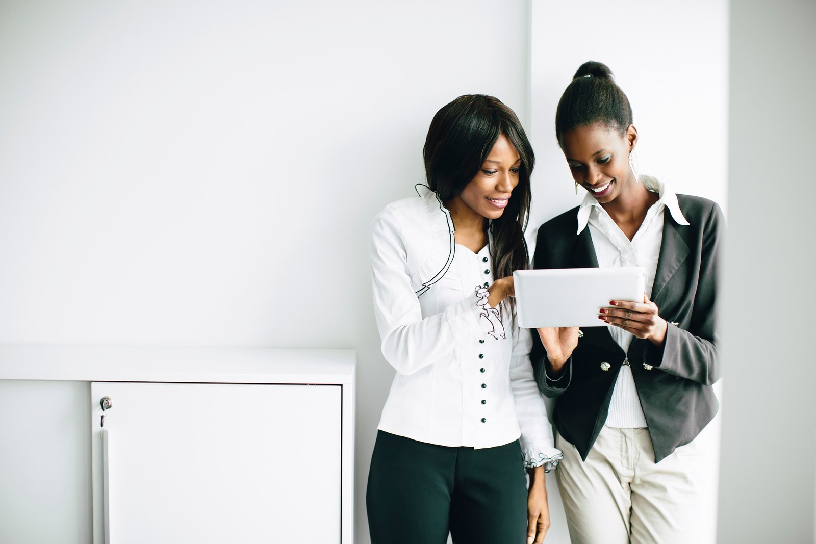 Colleagues Reading From a Tablet 